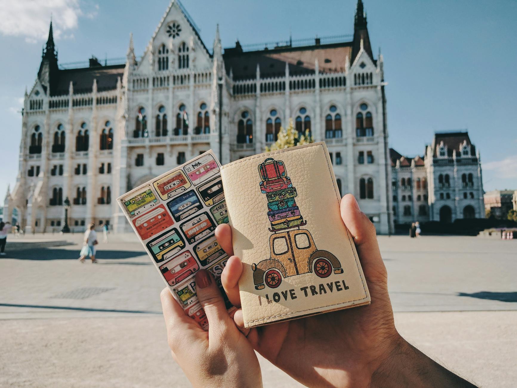 person holding passport holder
